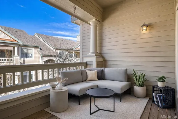 a blue bench sitting in front of a building
