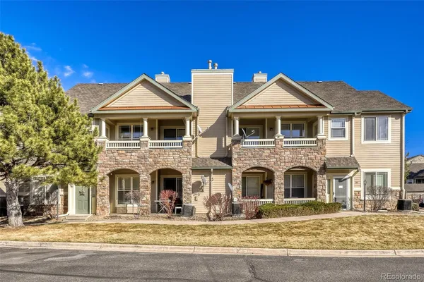 a front view of a house with large windows