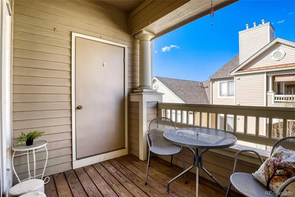 a view of a balcony with furniture