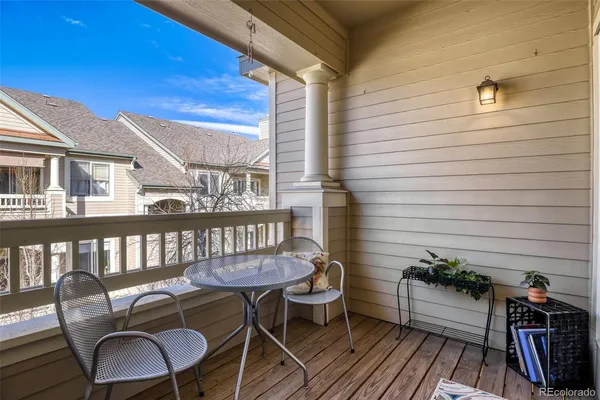 a view of a balcony with chairs