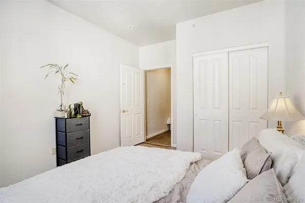 a bedroom with a bed and a dresser