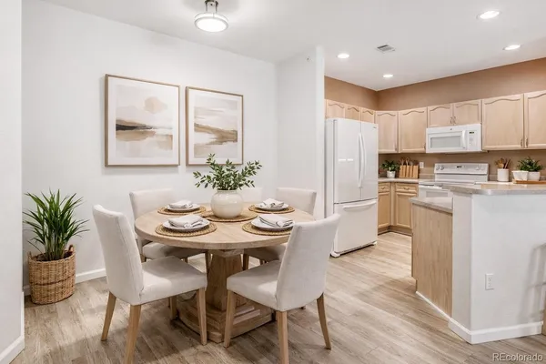 a view of a dining room with furniture and wooden floor