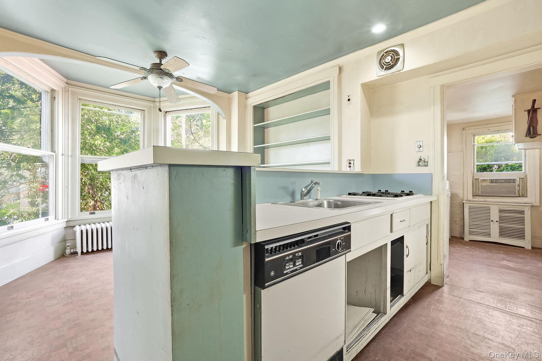 172 Main Street Cold Spring, NY 10516 - Photo 10 of 28 a kitchen with granite countertop a stove and a sink