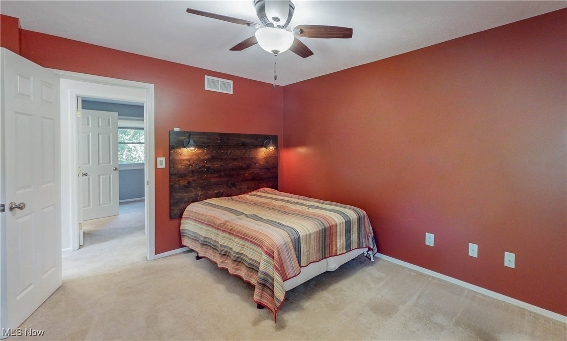 3491 Kent Road Stow, OH 44224 - Photo 21 of 40 Bedroom # 2 with ceiling fan, attached decorative headboard with light fixtures and carpet
