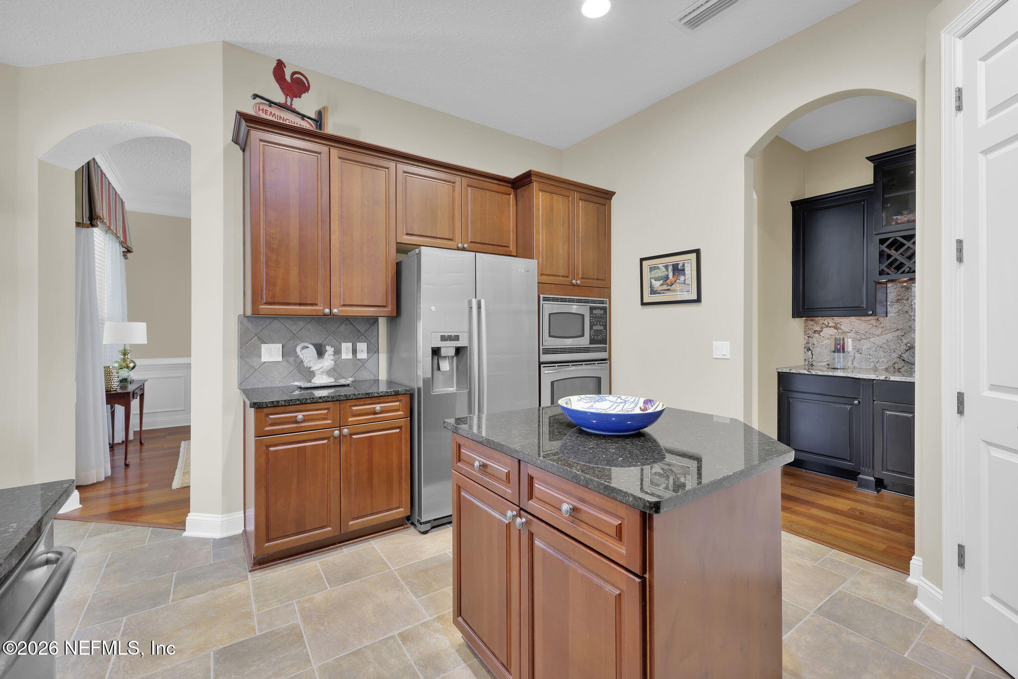 549 Sebastian Square St. Augustine, FL 32095 - Photo 12 of 51 a kitchen with stainless steel appliances granite countertop a refrigerator stove and sink