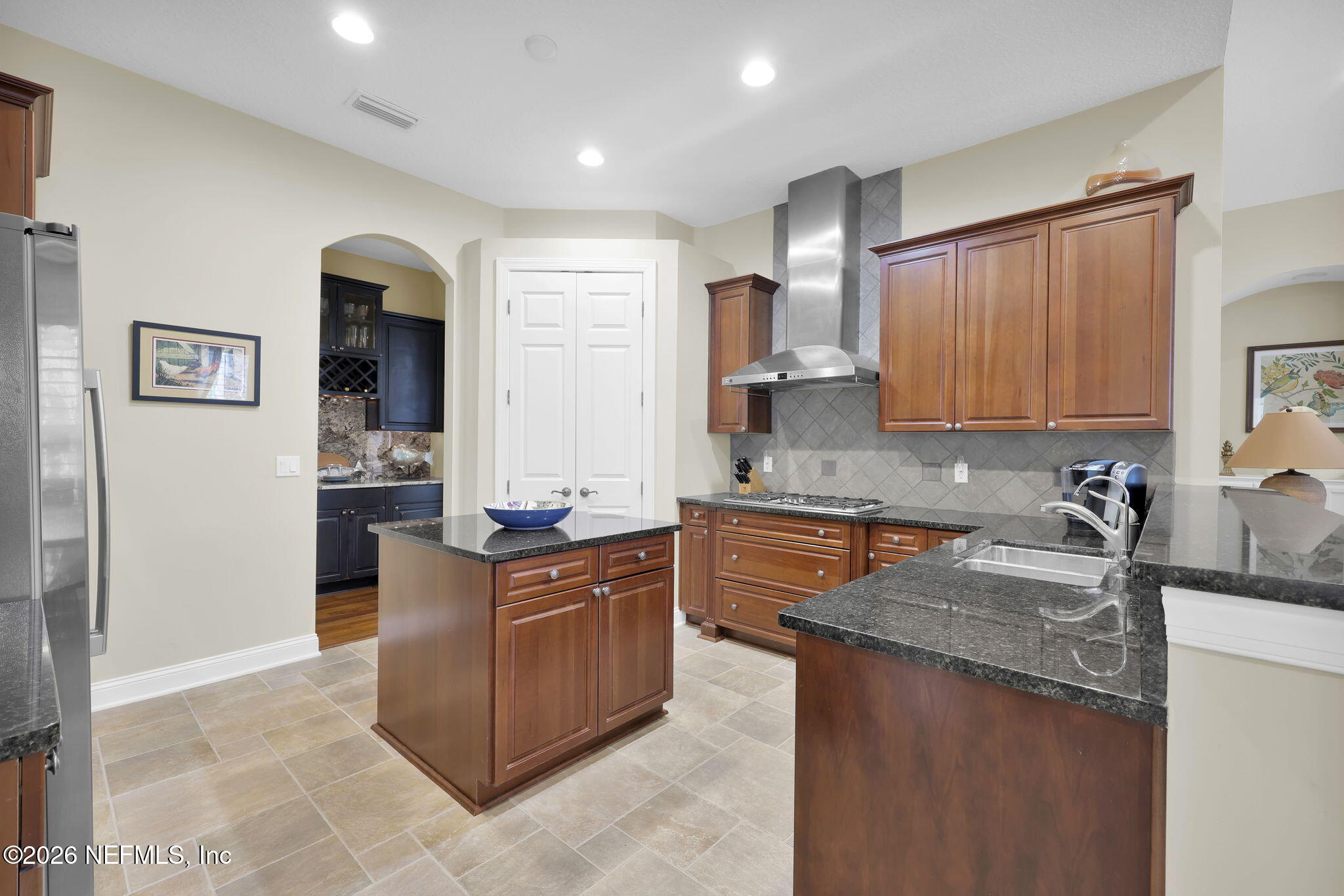 549 Sebastian Square St. Augustine, FL 32095 - Photo 14 of 51 a kitchen with stainless steel appliances granite countertop a sink stove and refrigerator
