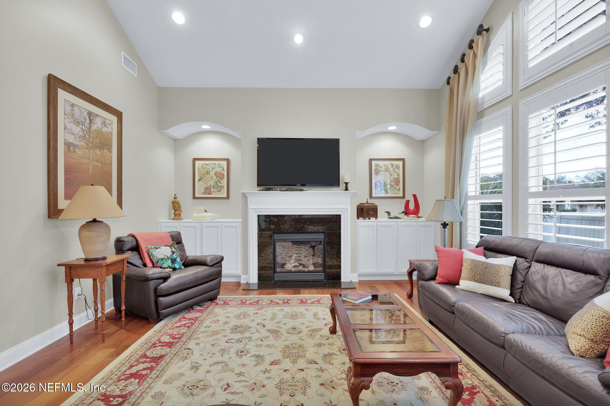 549 Sebastian Square St. Augustine, FL 32095 - Photo 19 of 51 a living room with furniture a flat screen tv and a fireplace