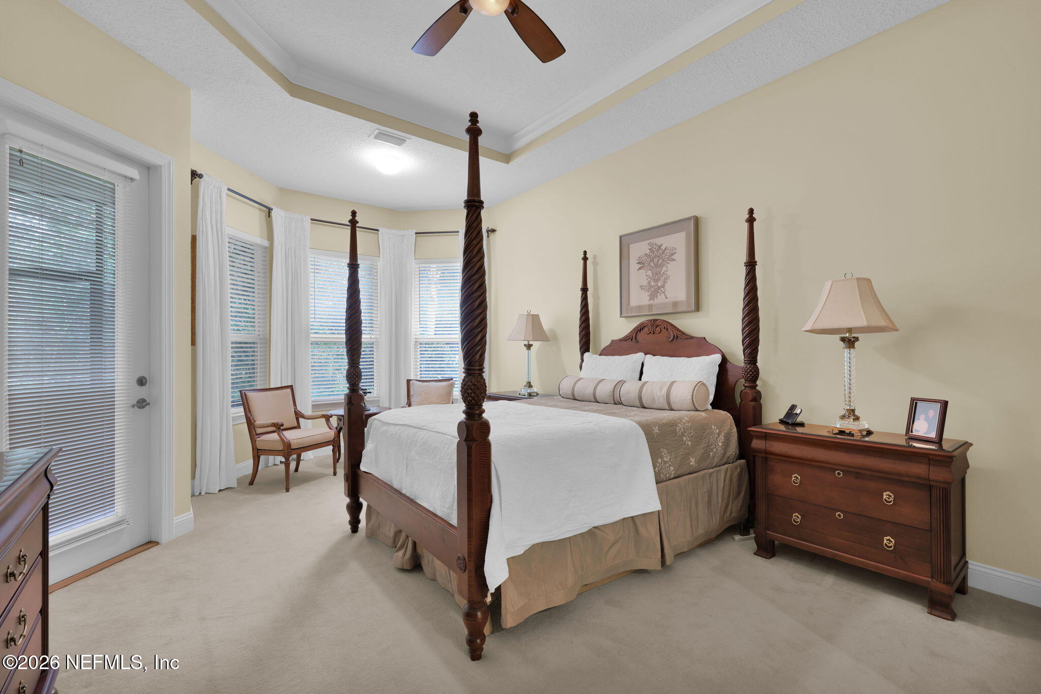 549 Sebastian Square St. Augustine, FL 32095 - Photo 22 of 51 a spacious bedroom with a bed and a chandelier
