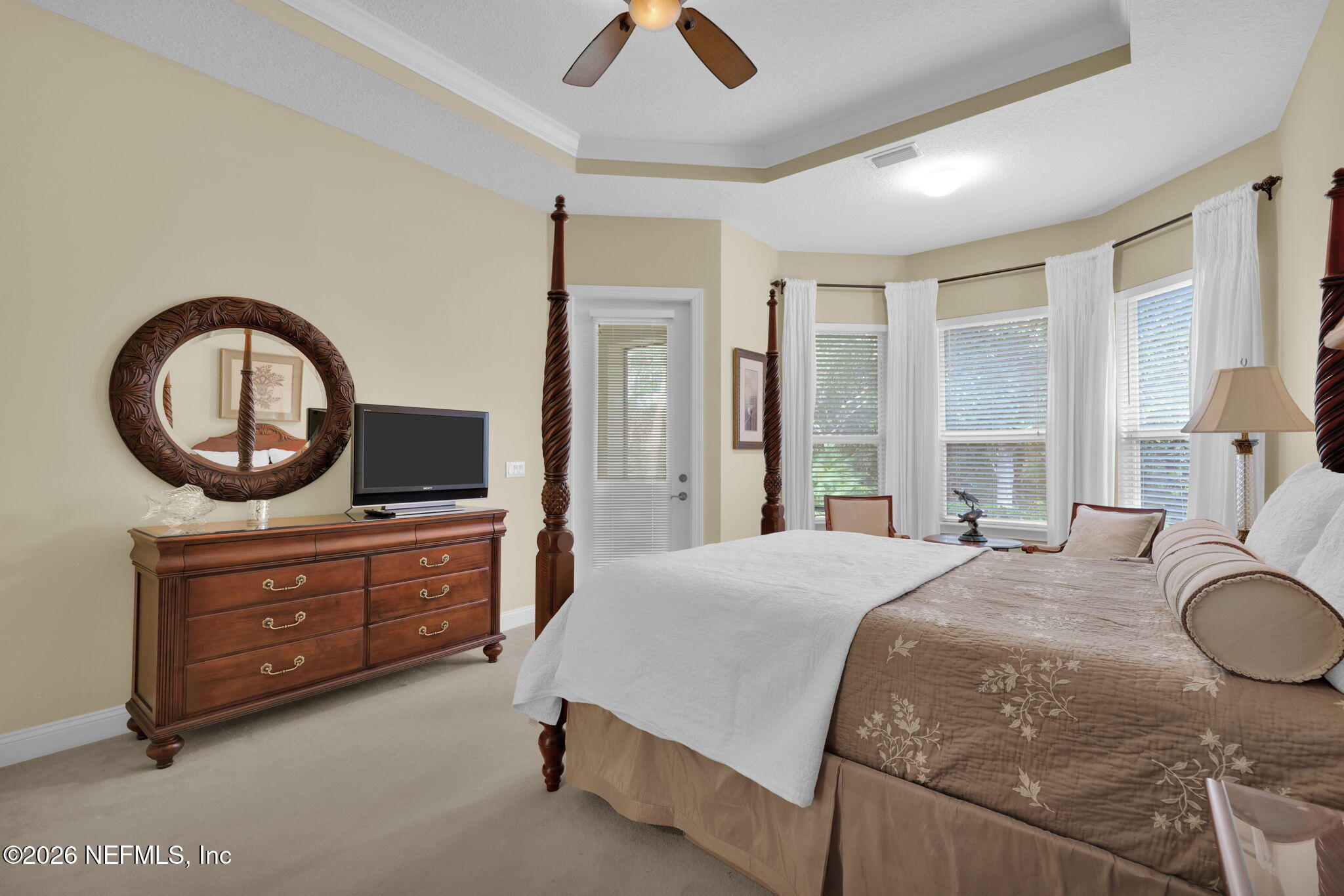 549 Sebastian Square St. Augustine, FL 32095 - Photo 24 of 51 a bedroom with a bed a dresser and flat screen tv