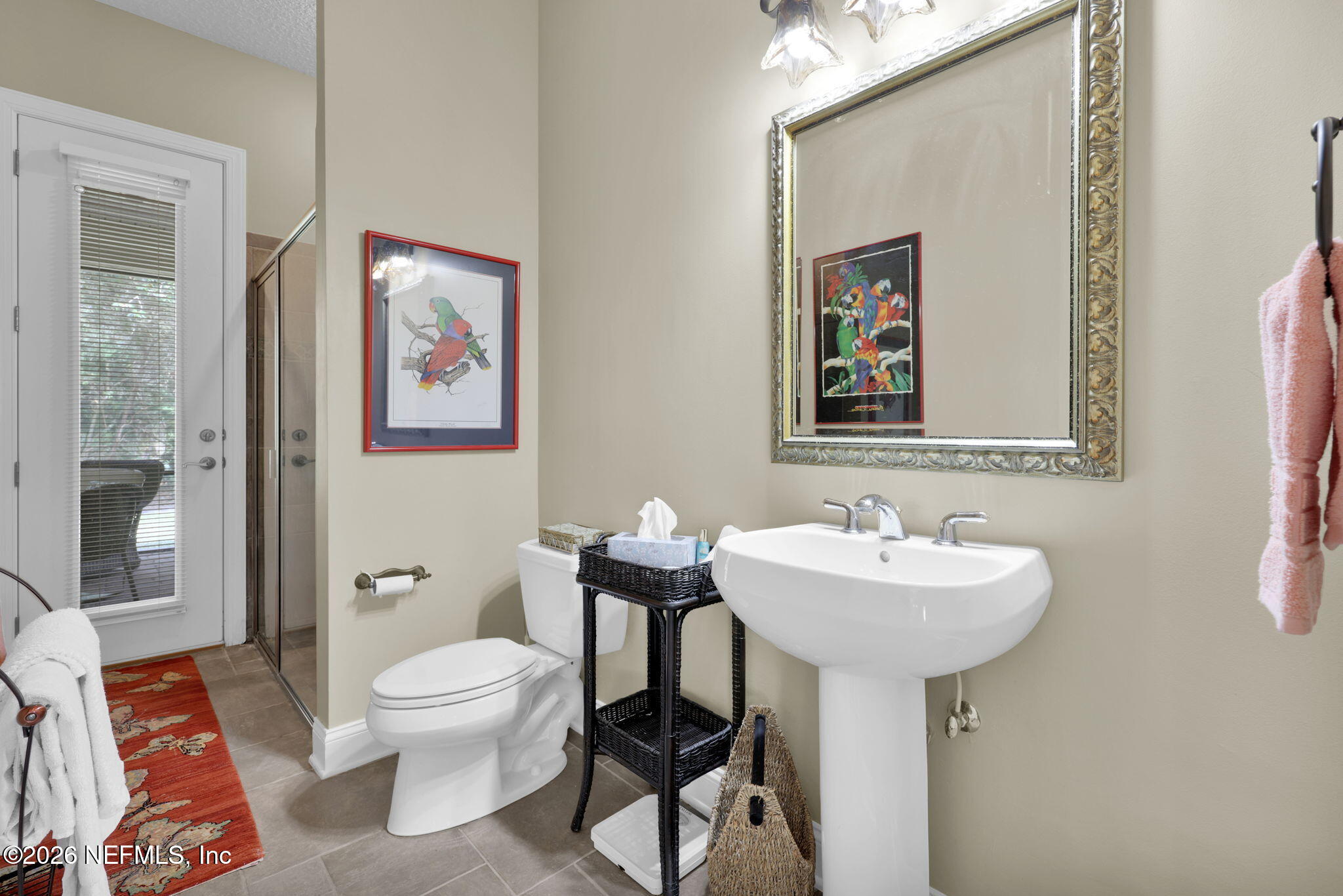 549 Sebastian Square St. Augustine, FL 32095 - Photo 30 of 51 a bathroom with a toilet a sink and mirror