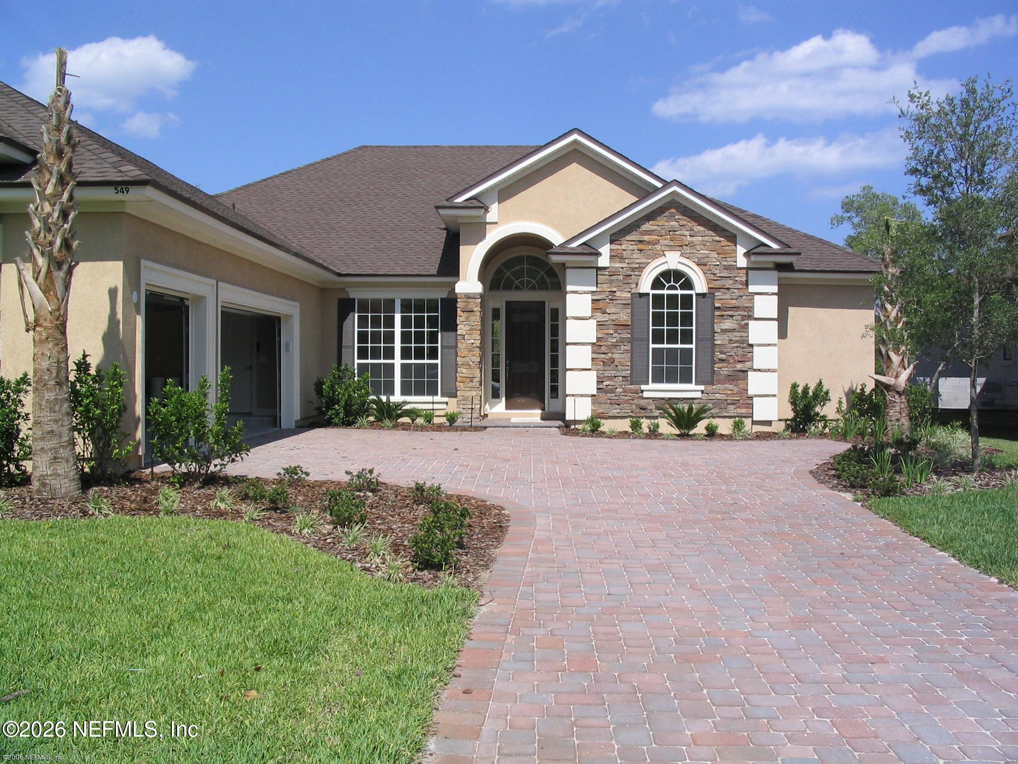 549 Sebastian Square St. Augustine, FL 32095 - Photo 5 of 51 a front view of a house with a yard and garage