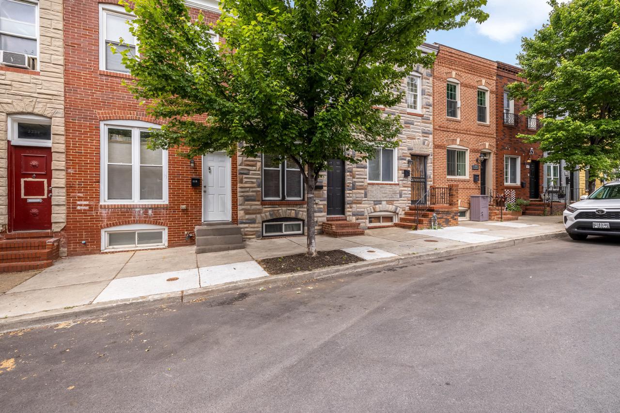 3240 Leverton Avenue Baltimore, MD 21224 - Photo 2 of 22 Charming row home with lush greenery.