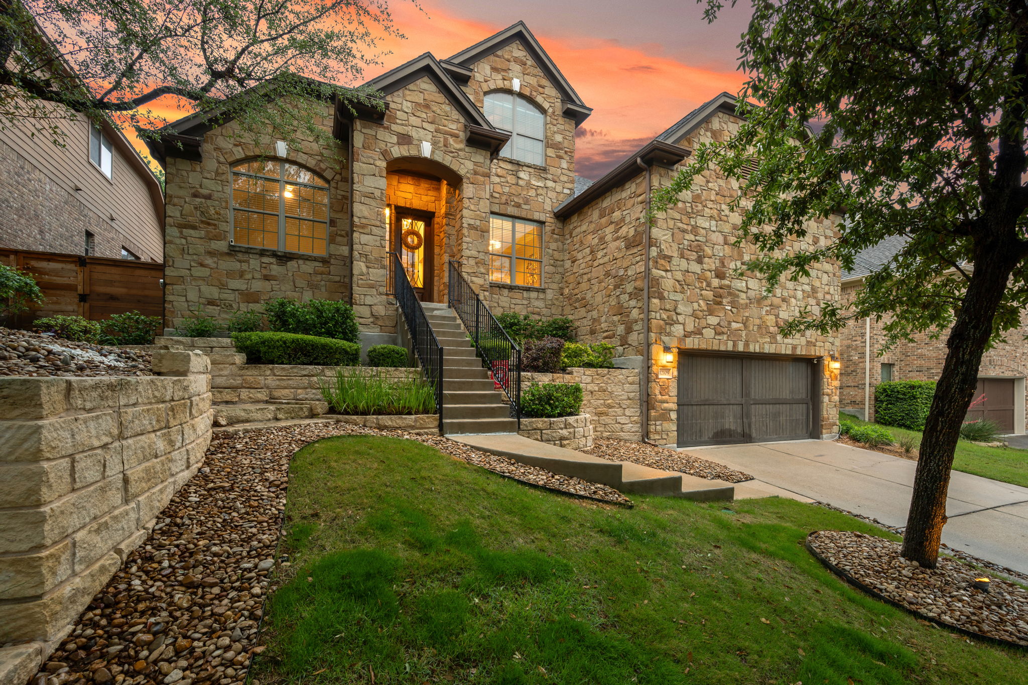 12109 Montclair Bend Austin, TX 78732 - Photo 1 of 39 Stone exterior residence with an arched entryway