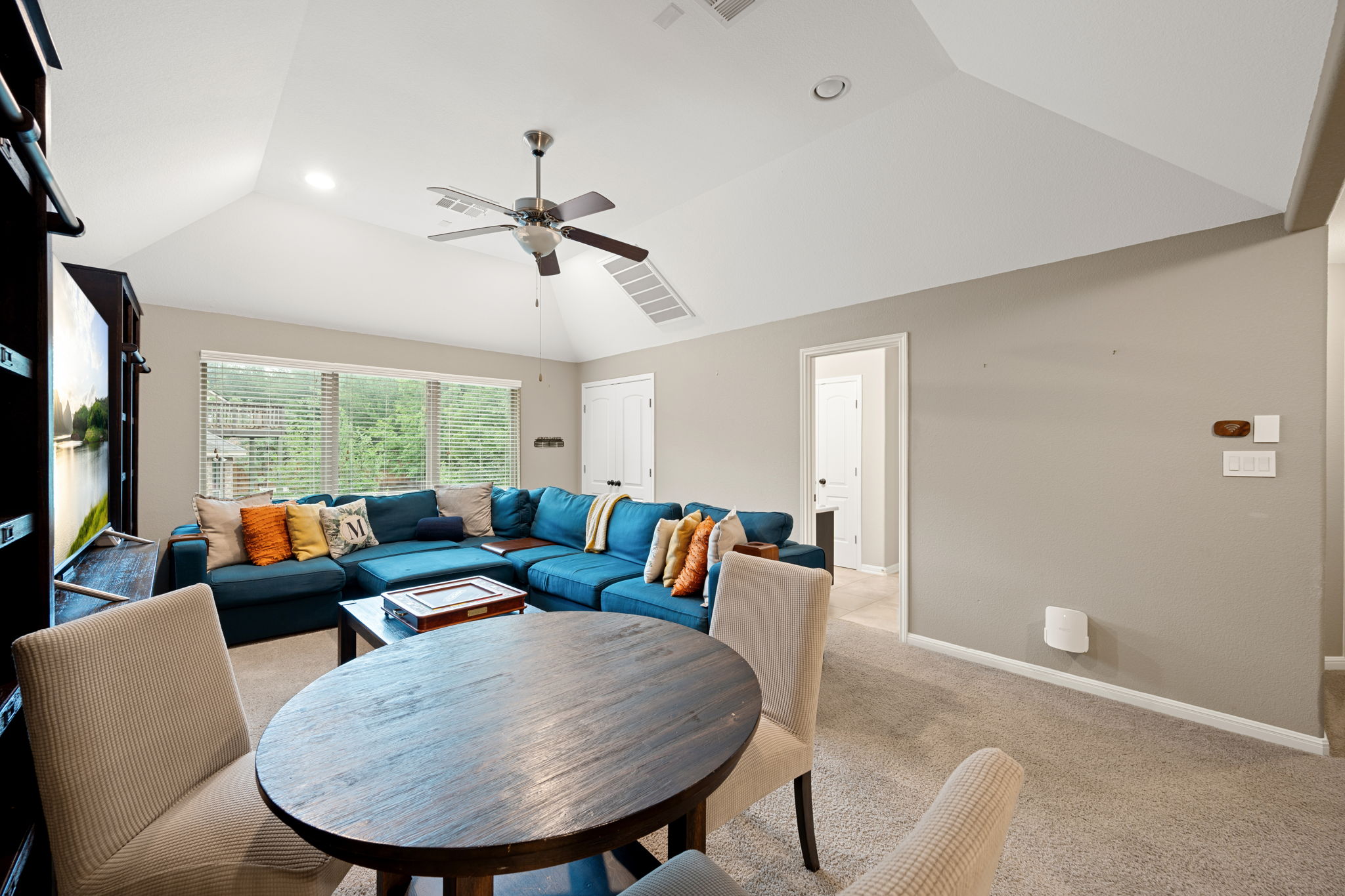 12109 Montclair Bend Austin, TX 78732 - Photo 21 of 39 Carpeted recreation room featuring an angled vaulted ceiling, recessed lighting, and a ceiling fan