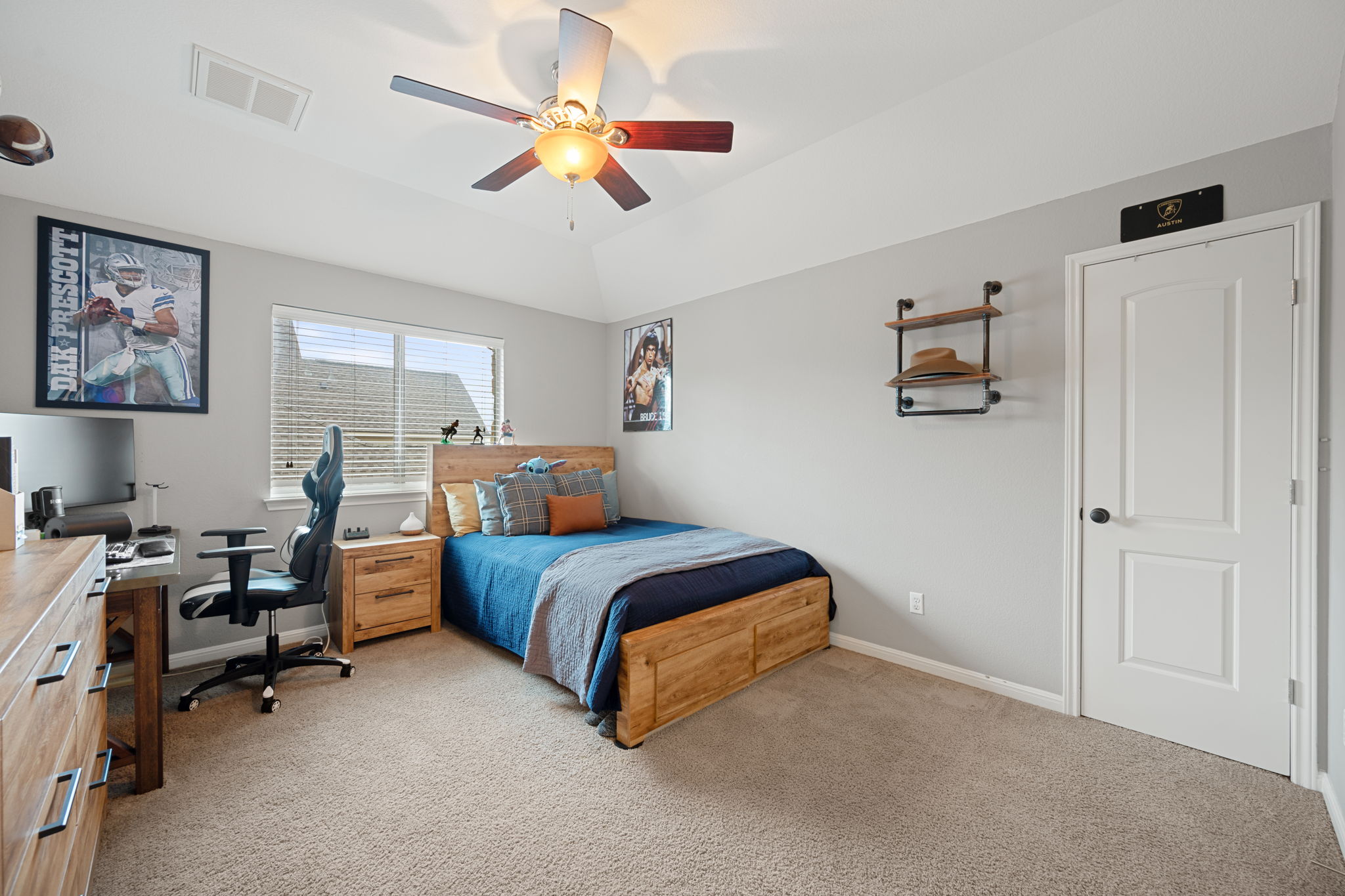 12109 Montclair Bend Austin, TX 78732 - Photo 26 of 39 Carpeted interior space featuring a ceiling fan with light fixture, window with blinds, and white door with black hardware