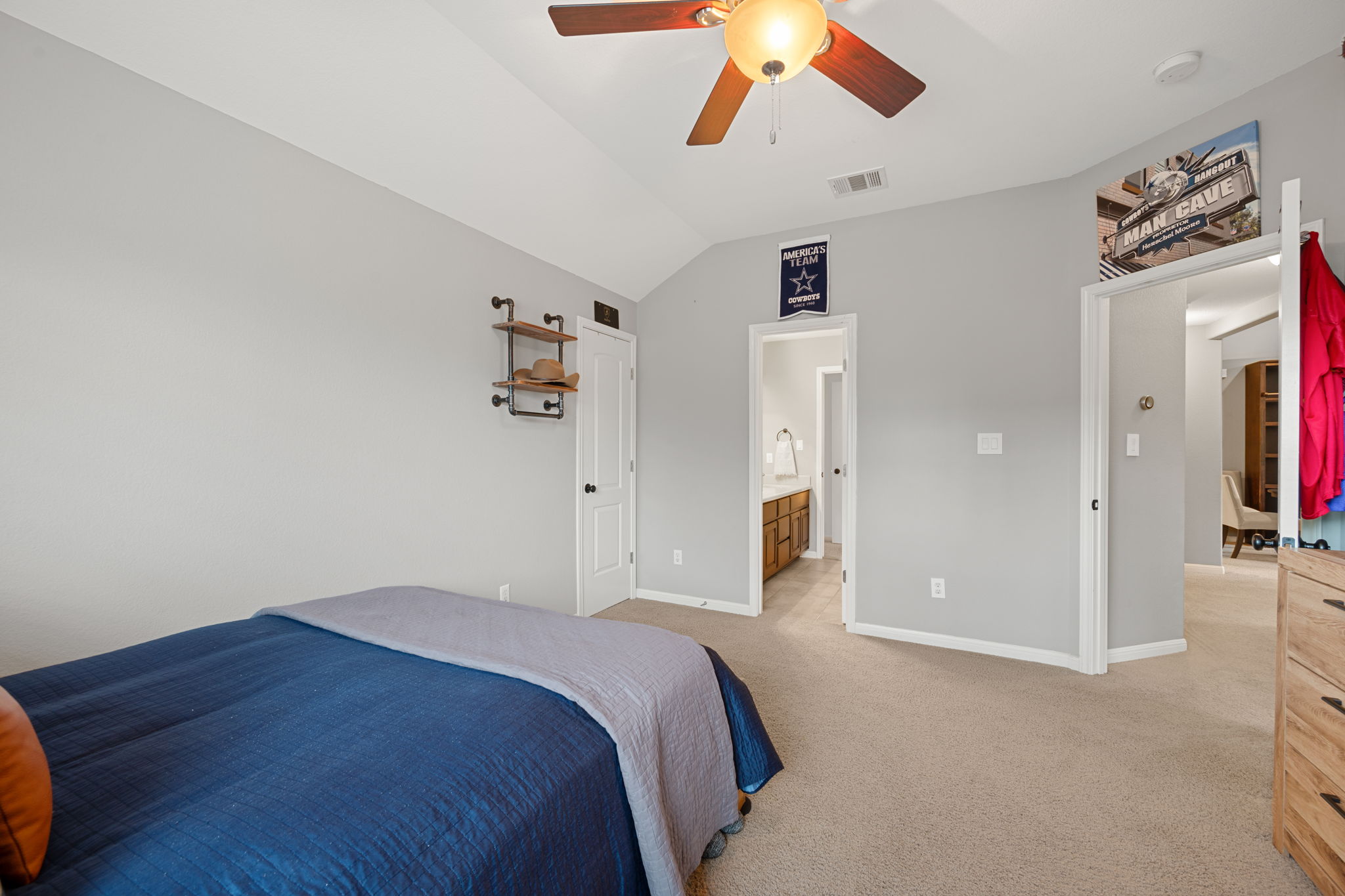 12109 Montclair Bend Austin, TX 78732 - Photo 27 of 39 Carpeted room featuring a vaulted ceiling with a ceiling fan and light fixture