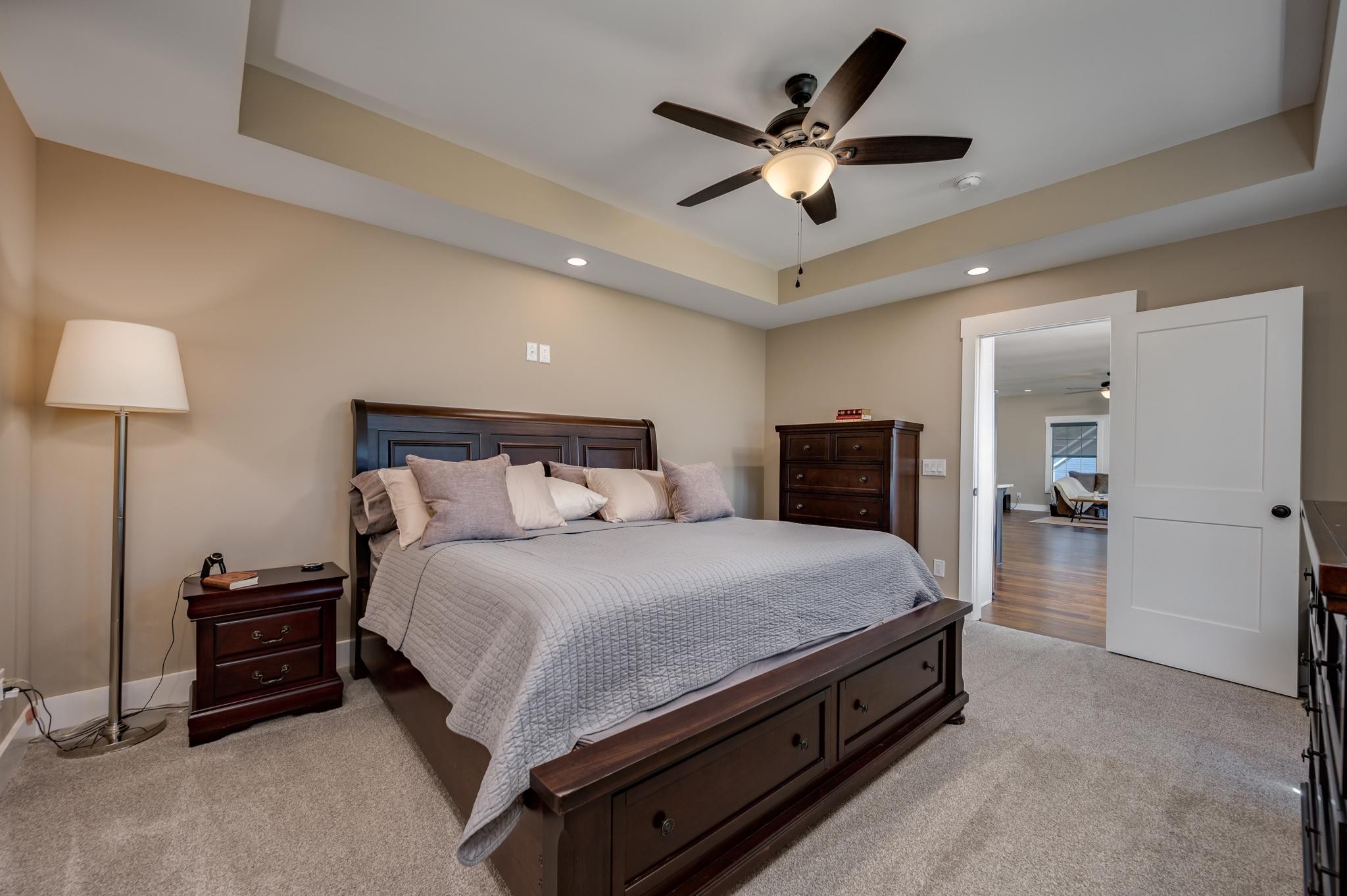 28 Taylor Road Manchester, TN 37355 - Photo 12 of 27 a spacious bedroom with a bed and a chandelier
