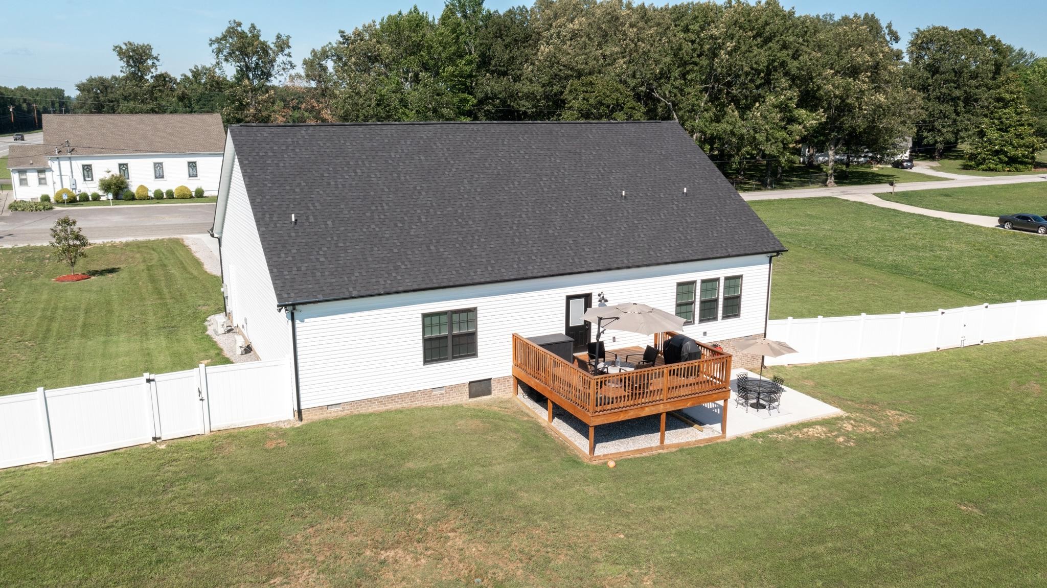 28 Taylor Road Manchester, TN 37355 - Photo 24 of 27 a backyard of a house with table and chairs