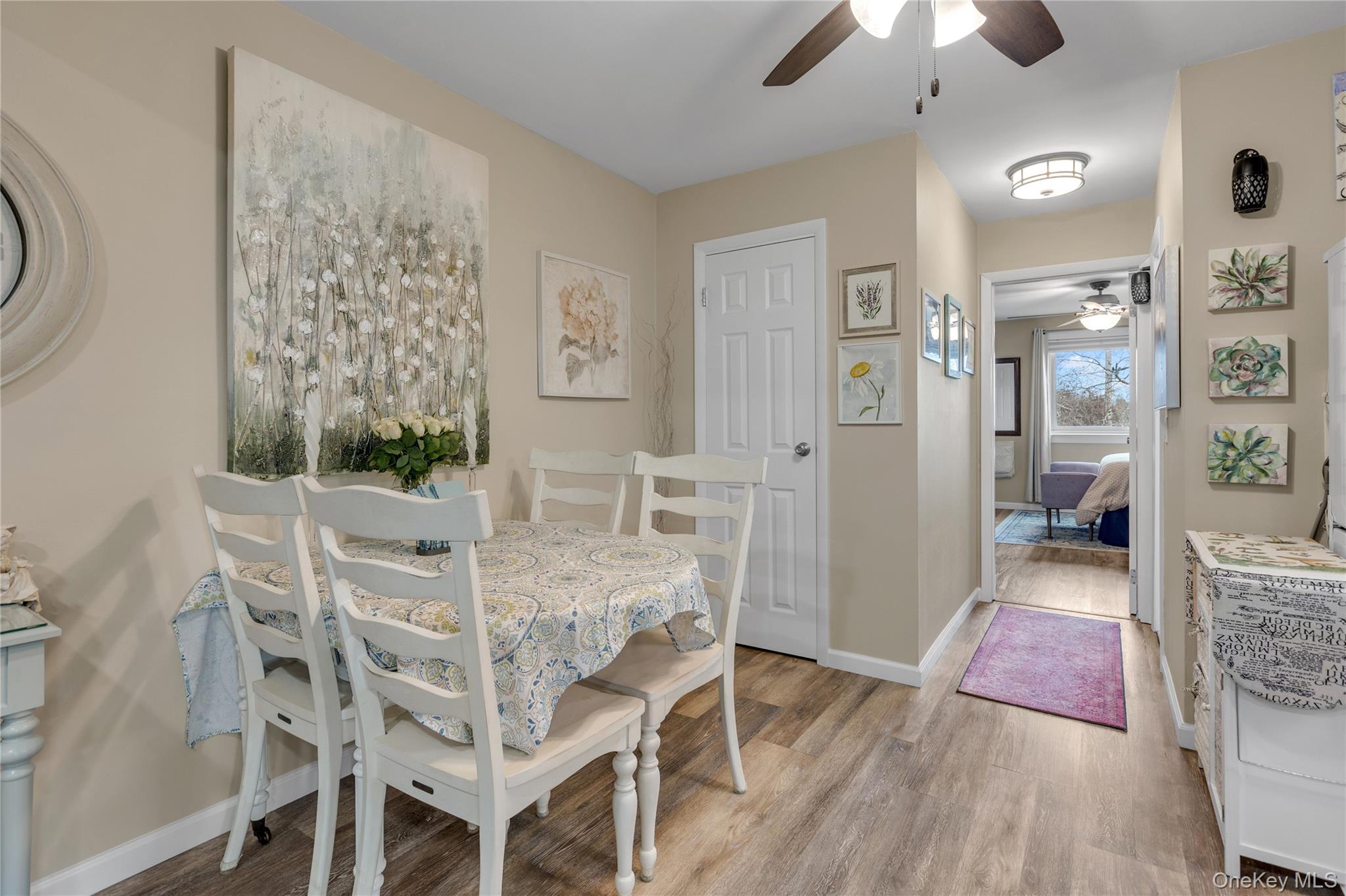 200 Merrick Road, Unit I Amityville, NY 11701 - Photo 5 of 12 Dining space with ceiling fan and light wood finished floors