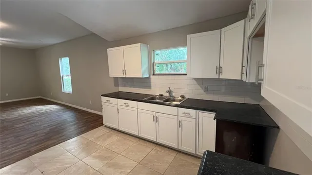 a bathroom with a toilet and a bath tub
