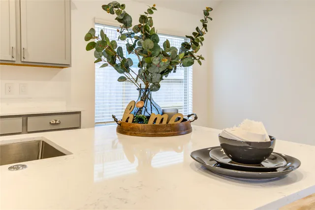 a vase of flowers sitting on a table