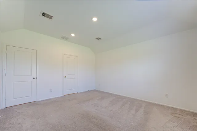 a bathroom with a sink a faucet a potted plant and a mirror
