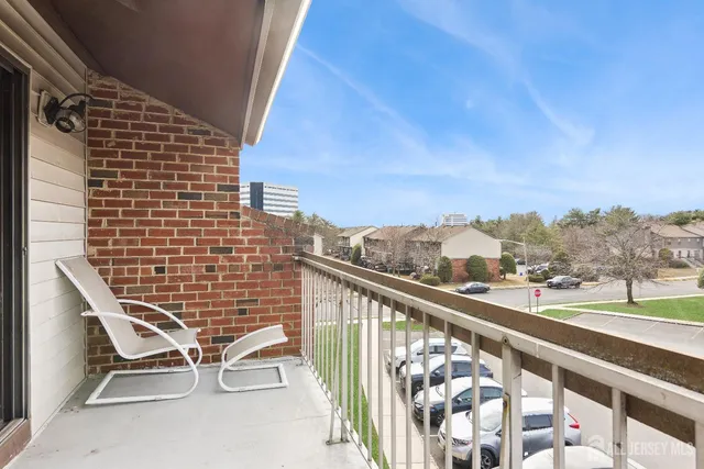 a view of balcony with wooden floor and city view