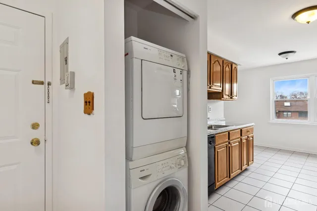 a view of a bathroom with washer and dryer
