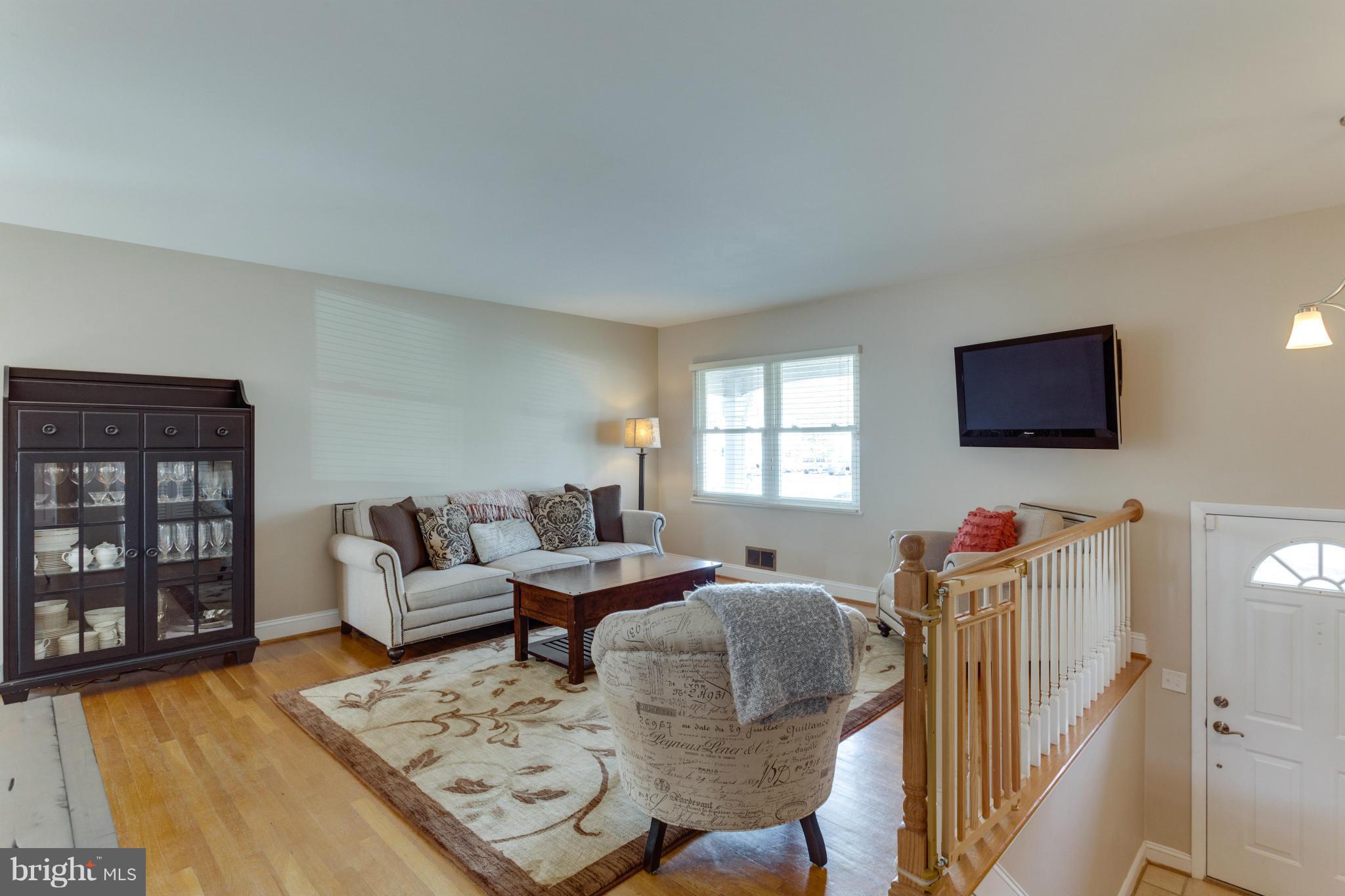 8814 Fort Hunt Road Alexandria, VA 22308 - Photo 2 of 30 Bright interior and gleaming hardwood floors