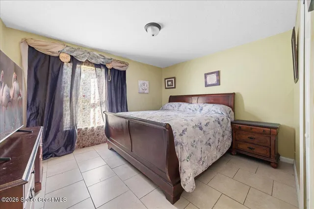 a bathroom with a sink mirror and toilet