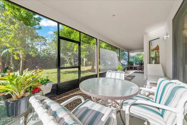 a outdoor dining room with furniture and a potted plant