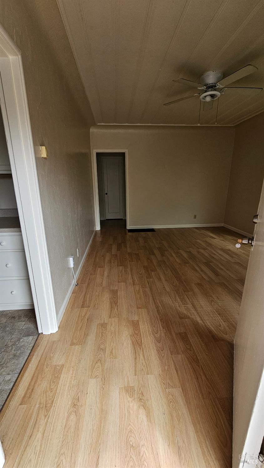 1448 Rice Street, Unit A Vallejo, CA 94590 - Photo 4 of 8 a view of empty room with wooden floor
