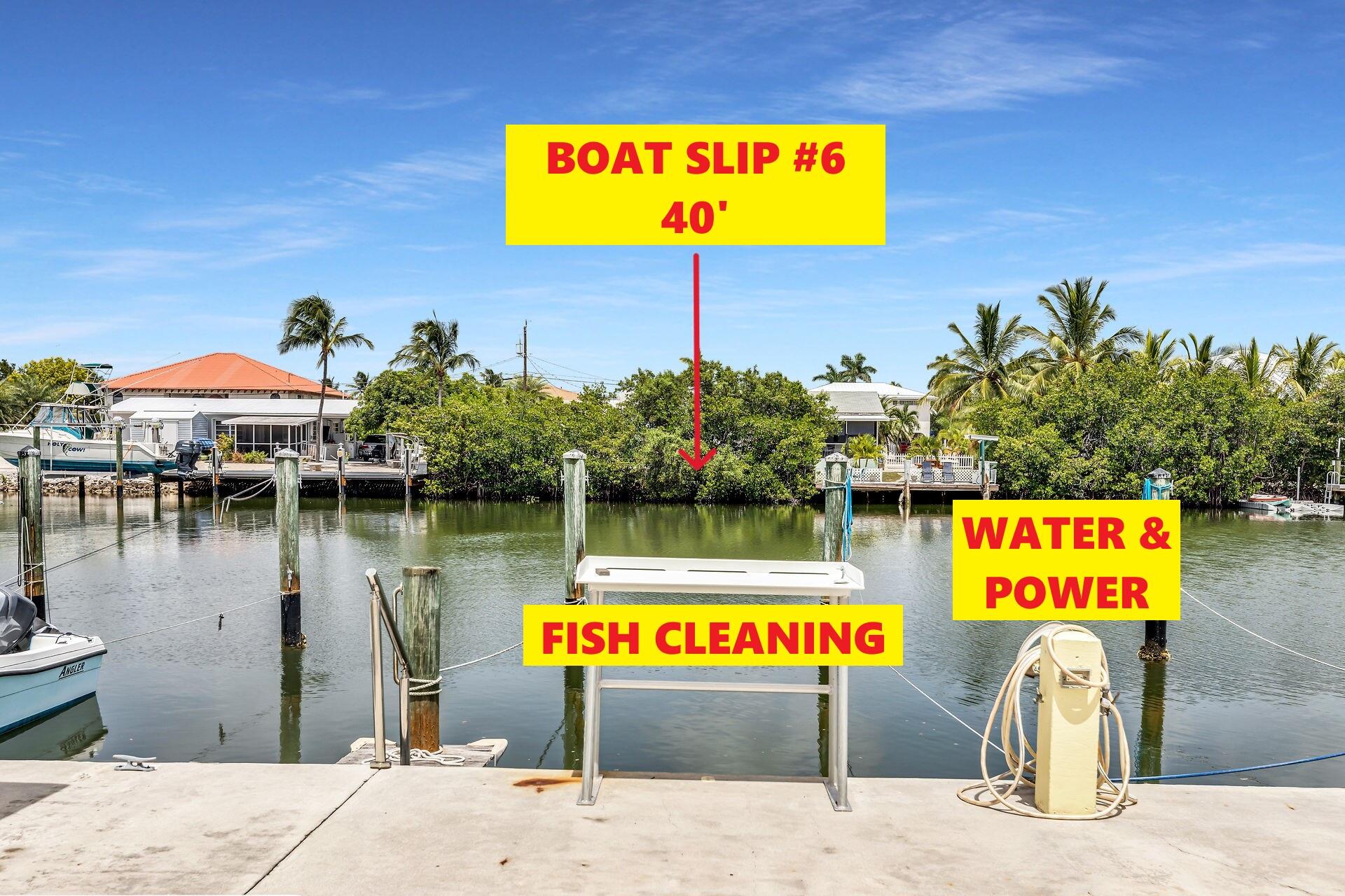 109 Ave D, Unit 305 Marathon, FL 33050 - Photo 18 of 41 a sign that is on the side of a building