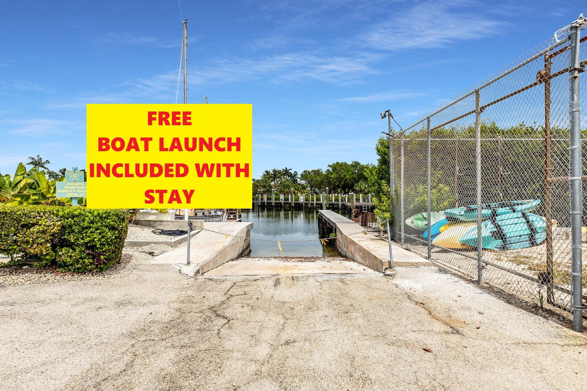 109 Ave D, Unit 305 Marathon, FL 33050 - Photo 20 of 41 a sign board with the outdoor seating