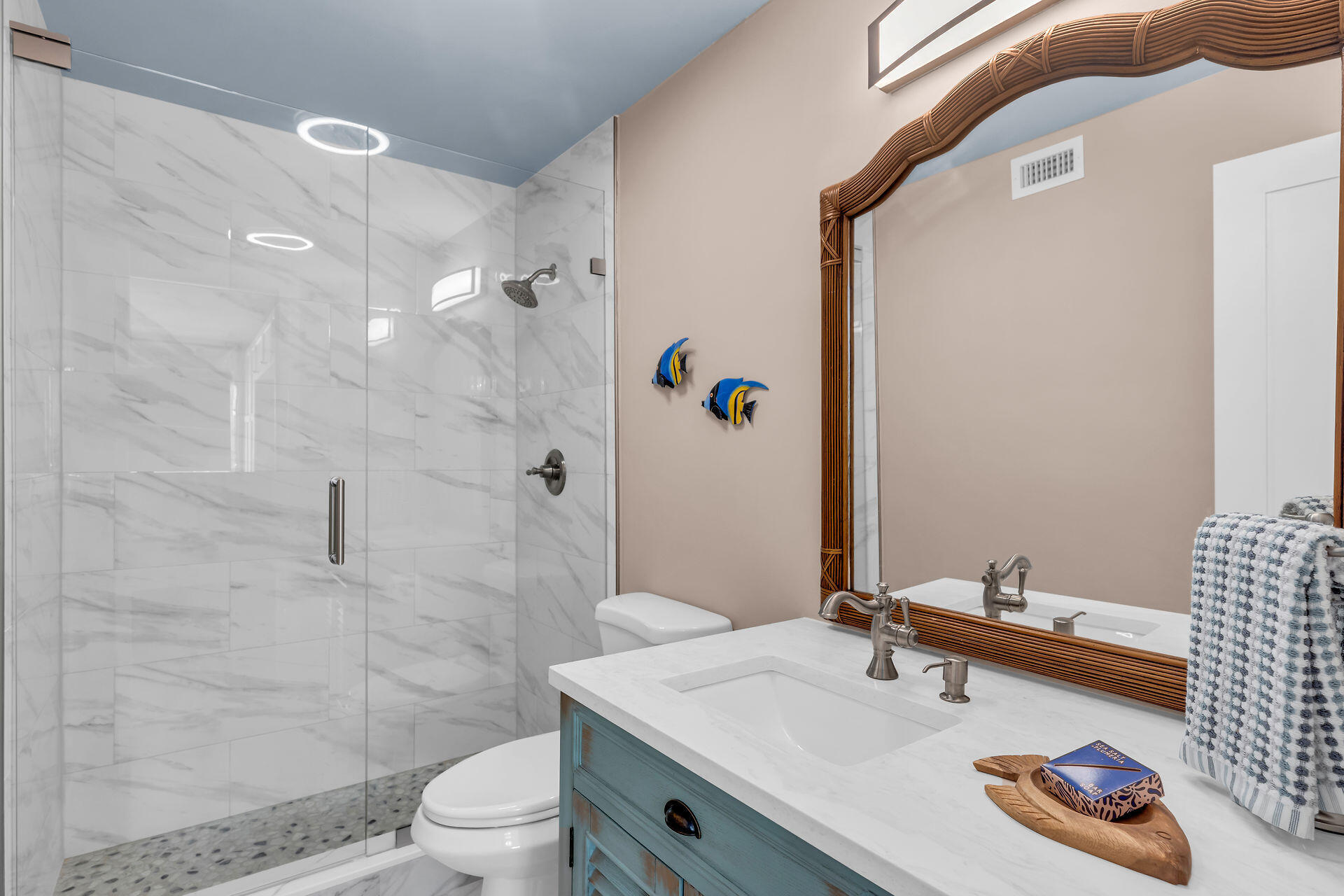 109 Ave D, Unit 305 Marathon, FL 33050 - Photo 32 of 41 a bathroom with a sink a toilet and shower