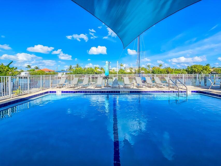 109 Ave D, Unit 305 Marathon, FL 33050 - Photo 6 of 41 a view of swimming pool with outdoor seating