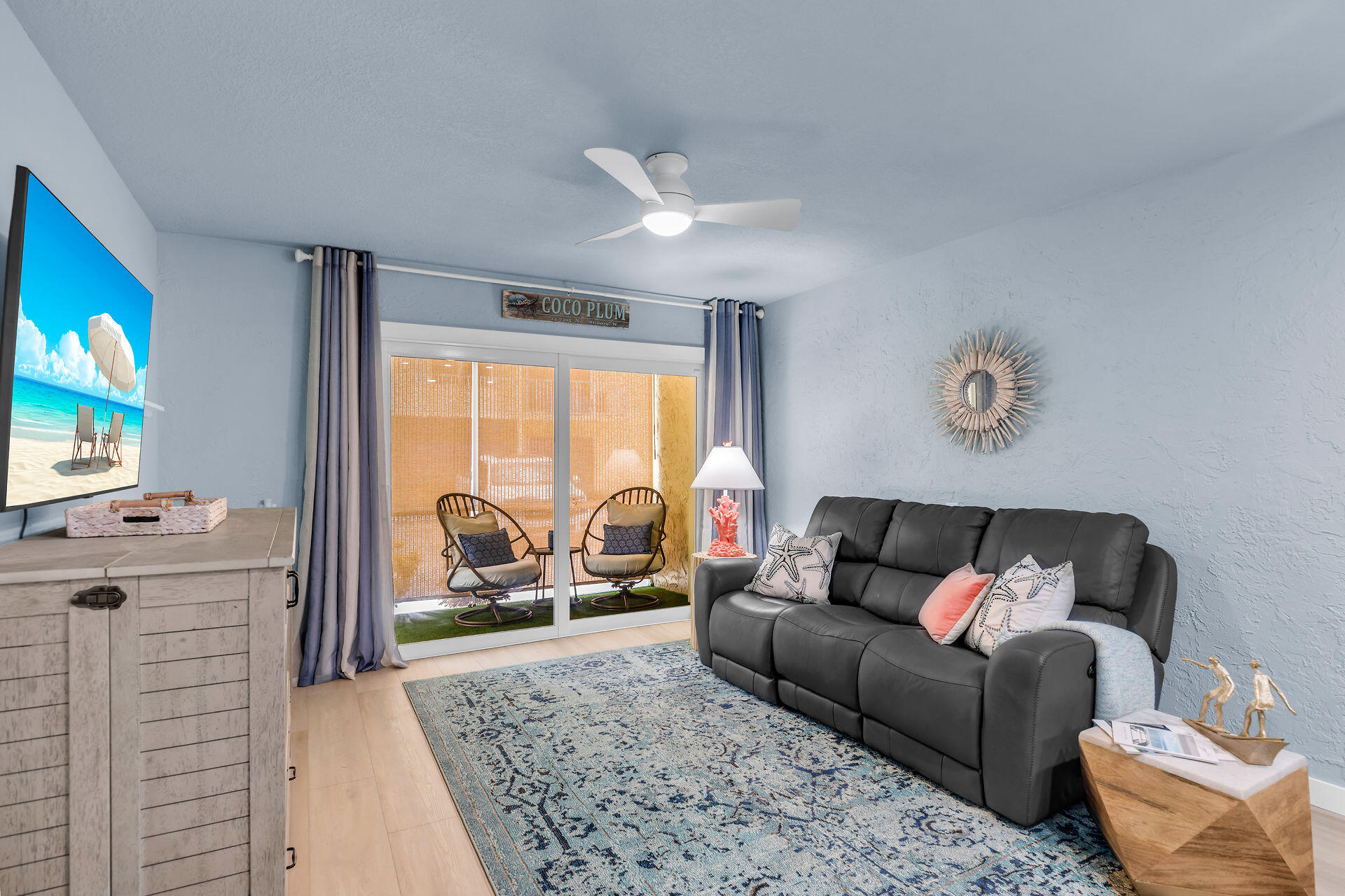 109 Ave D, Unit 305 Marathon, FL 33050 - Photo 10 of 41 a living room with furniture and a flat screen tv