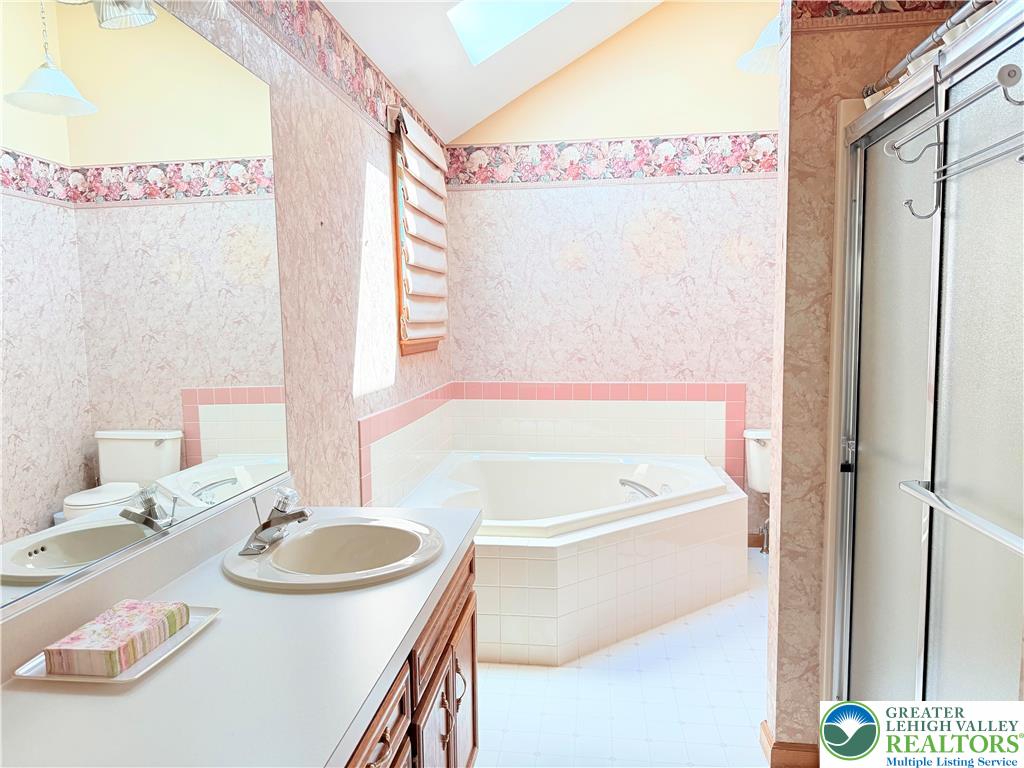 4165 Alder Road Bethlehem, PA 18020 - Photo 21 of 42 a bathroom with a sink a bathtub and a mirror