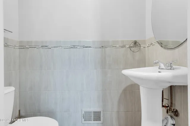 a bathroom with a sink and mirror