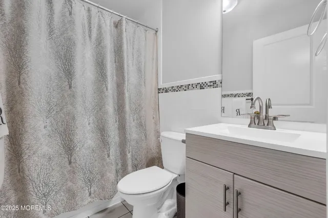 a bedroom with furniture and wooden floor