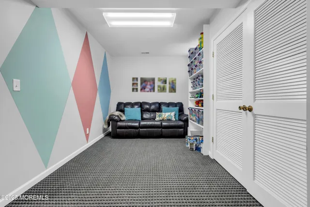 a living room with a couch and a rug