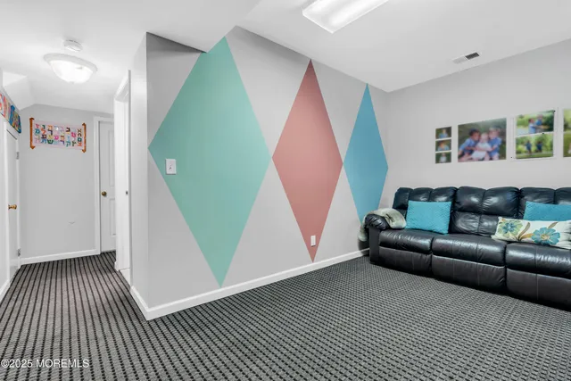 a bedroom with a bed and a large mirror