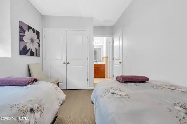 a bedroom with a bed and a chair