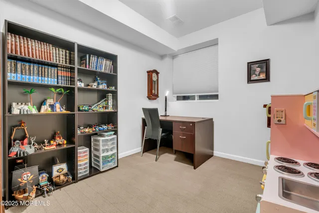 a view of living room with furniture and a window