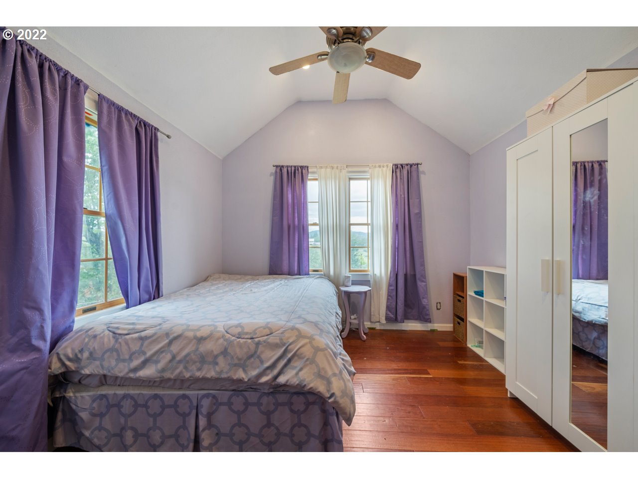8480 Northeast Dog Ridge Road Newberg, OR 97132 - Photo 22 of 30 a bedroom with a bed dresser and a window