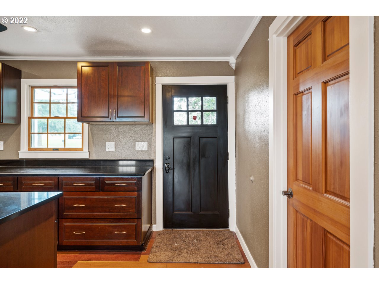 8480 Northeast Dog Ridge Road Newberg, OR 97132 - Photo 3 of 30 a kitchen with a refrigerator and cabinets