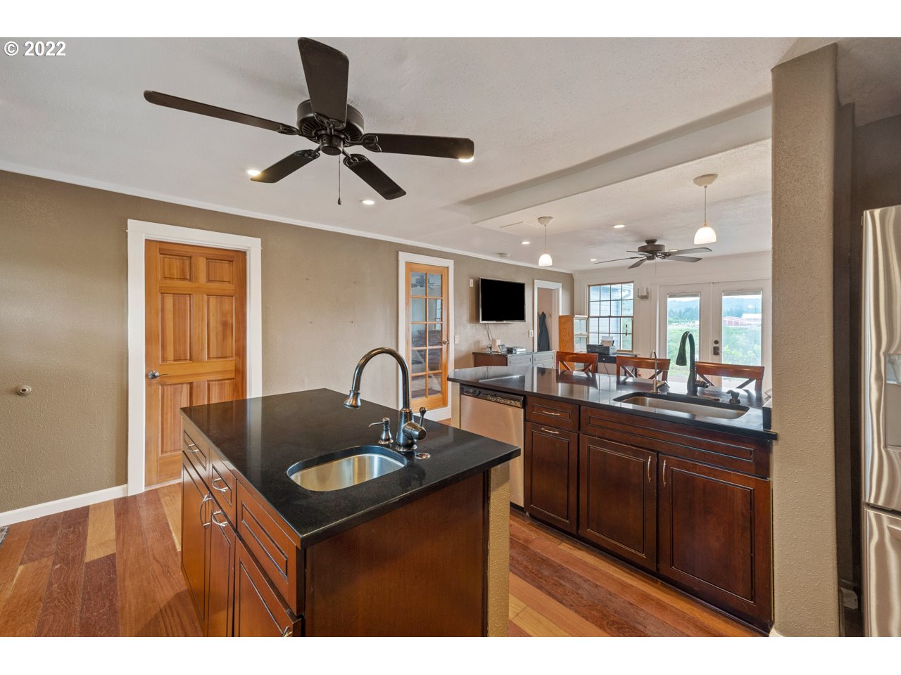 8480 Northeast Dog Ridge Road Newberg, OR 97132 - Photo 4 of 30 a kitchen with a sink cabinets and wooden floor