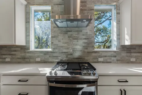 a sink sitting inside of a kitchen