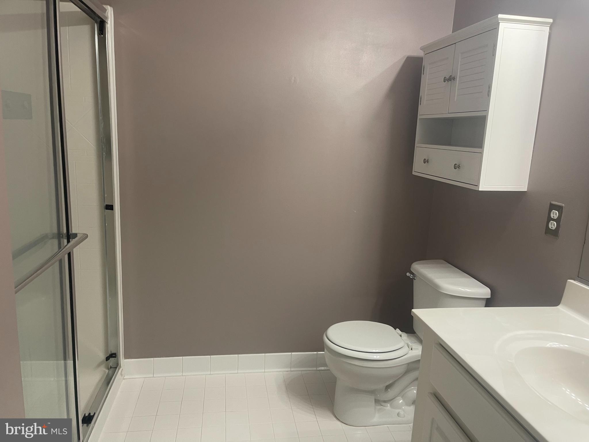 402 Aggies Circle, Unit L Bel Air, MD 21014 - Photo 14 of 23 a white toilet sitting next to a bathroom sink