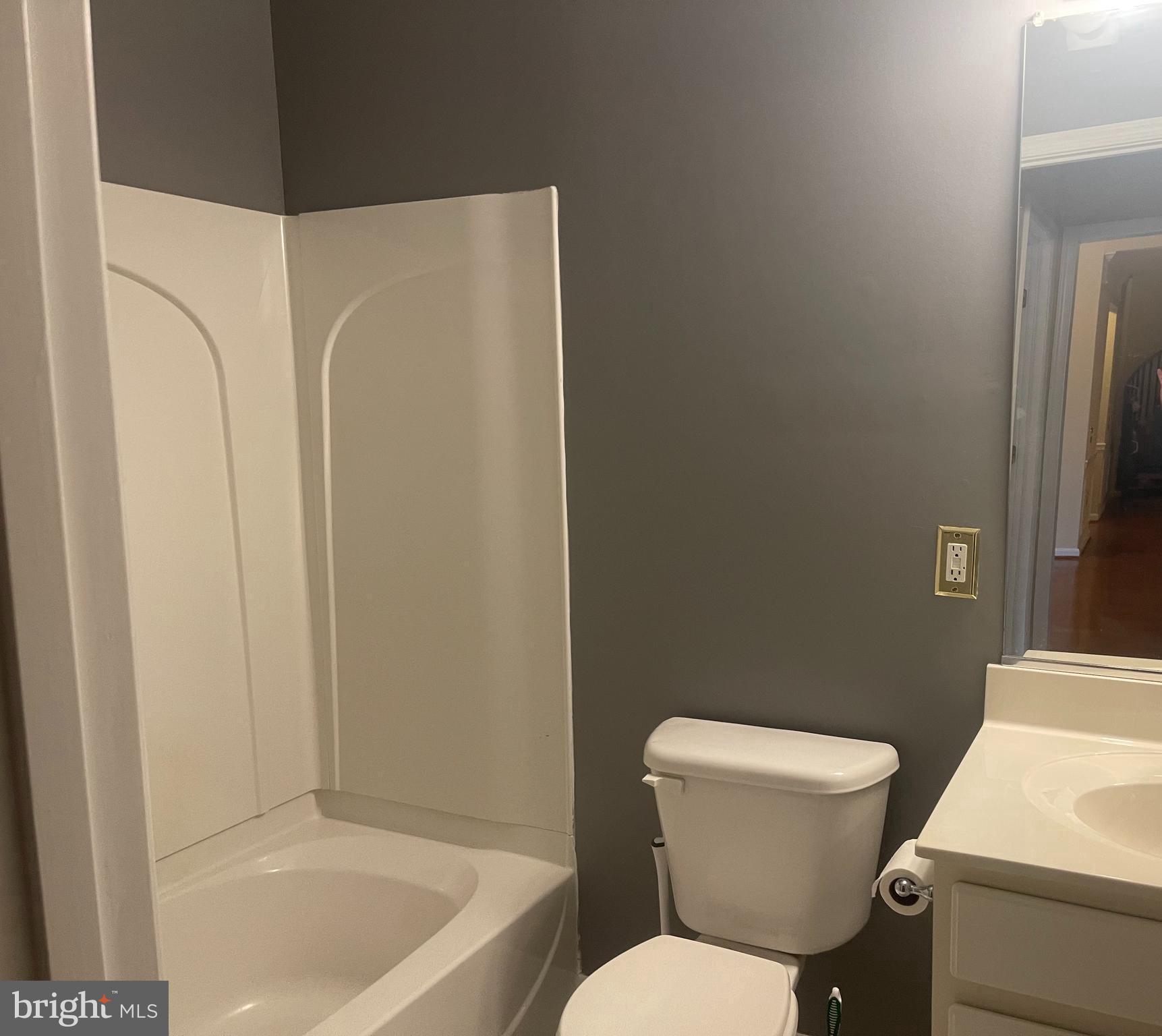 402 Aggies Circle, Unit L Bel Air, MD 21014 - Photo 16 of 23 a white toilet sitting next to a bathroom sink